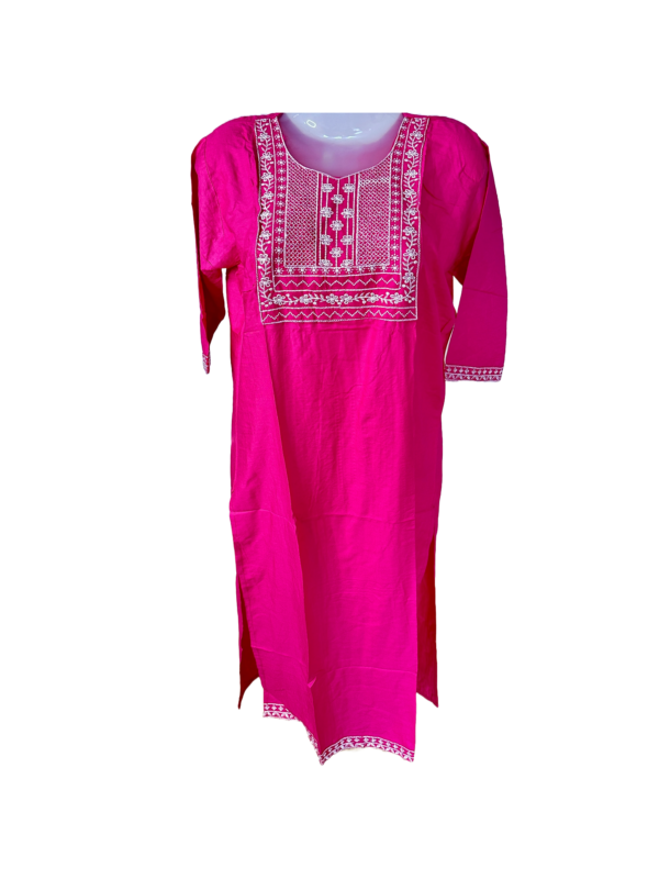 a pink dress with white embroidery