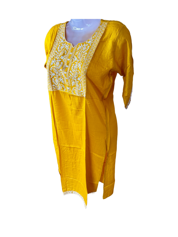 a yellow dress on a mannequin